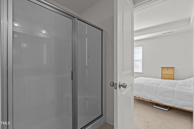 bathroom featuring a stall shower and visible vents