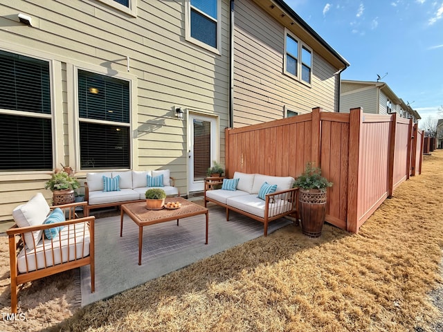 view of patio with fence and an outdoor hangout area