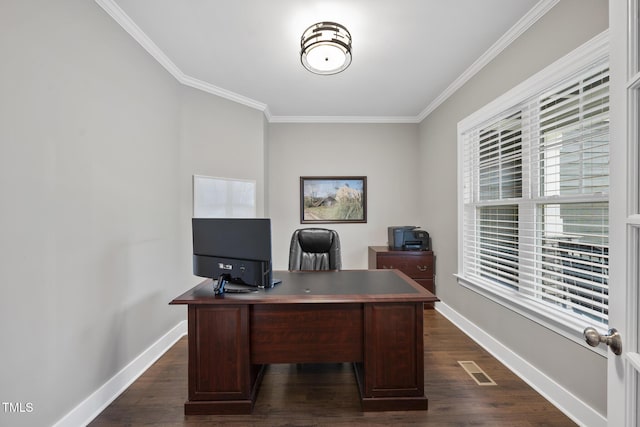 office with visible vents, dark wood-type flooring, baseboards, and ornamental molding