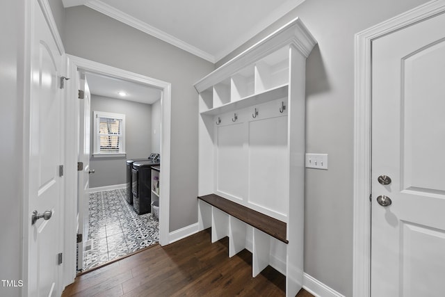 mudroom with baseboards, independent washer and dryer, dark wood finished floors, and ornamental molding