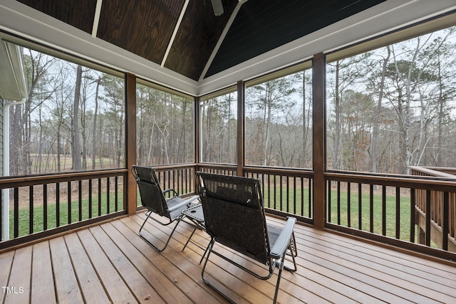 unfurnished sunroom featuring a wealth of natural light, wood ceiling, and vaulted ceiling