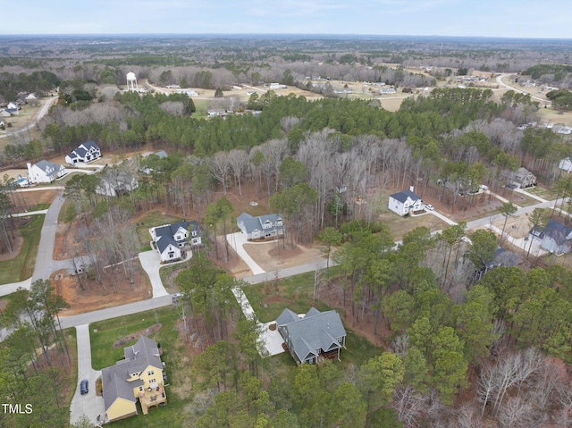 bird's eye view featuring a forest view