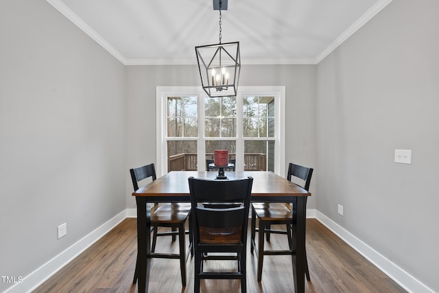 dining area featuring baseboards, ornamental molding, and dark wood-style flooring