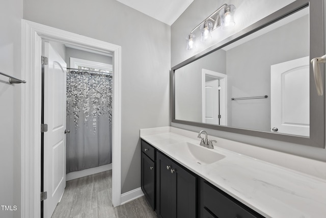 bathroom with vanity and curtained shower