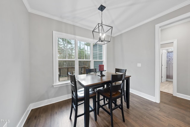 dining room with baseboards, an inviting chandelier, ornamental molding, and dark wood-style flooring