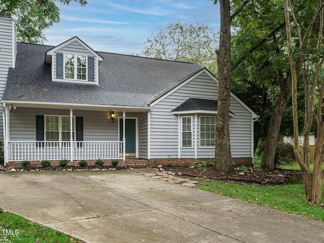 view of front of house featuring a porch and a shingled roof