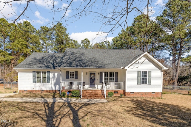 cape cod house with roof with shingles, a porch, crawl space, and fence