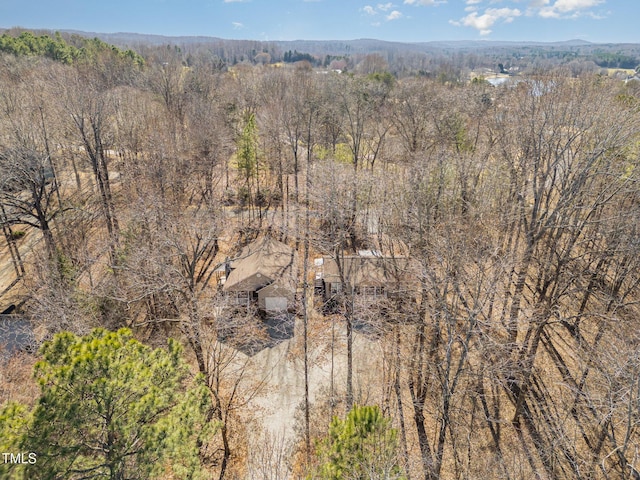 drone / aerial view with a view of trees