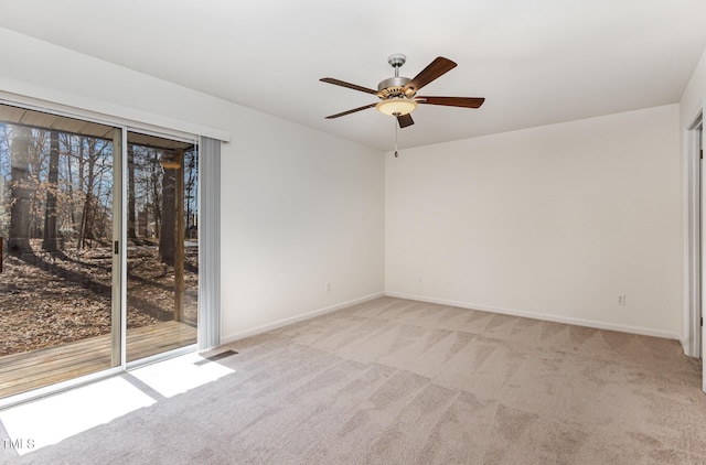 empty room with light carpet, plenty of natural light, visible vents, and baseboards