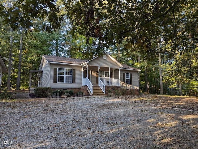 view of front of home with crawl space and covered porch