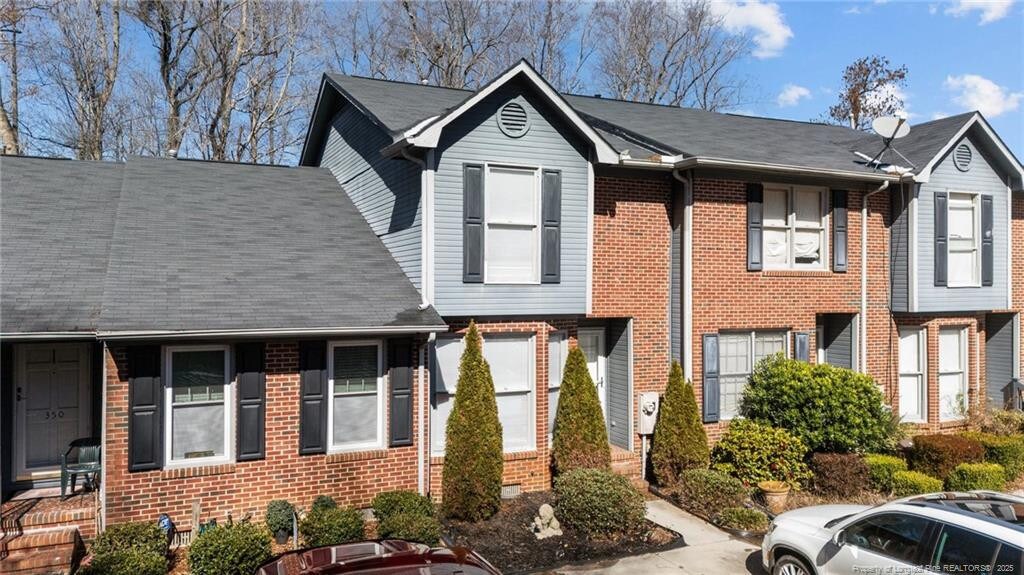 view of property with brick siding