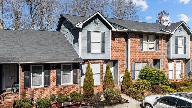 view of property with brick siding