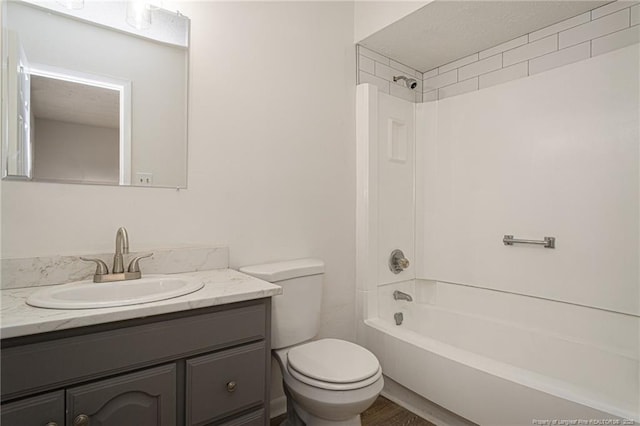 full bathroom with shower / bathtub combination, vanity, and toilet