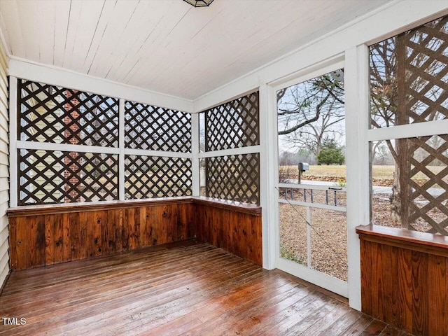 unfurnished sunroom with wooden ceiling