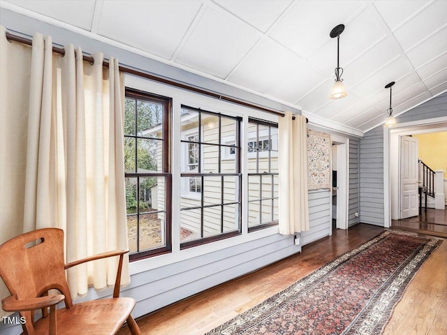 interior space with lofted ceiling and dark wood finished floors