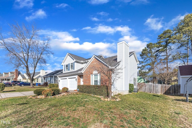 view of front facade featuring a garage, concrete driveway, fence, a front lawn, and brick siding