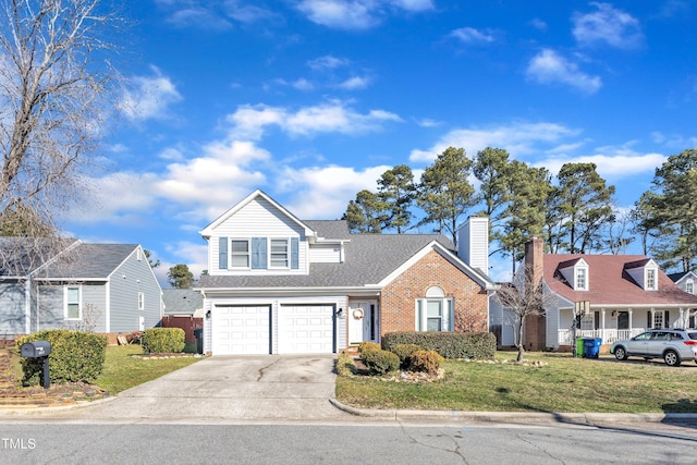 traditional-style home with brick siding, a chimney, concrete driveway, a front yard, and a garage