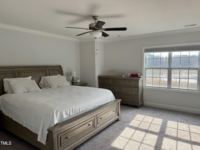 bedroom with ornamental molding, light colored carpet, visible vents, and baseboards