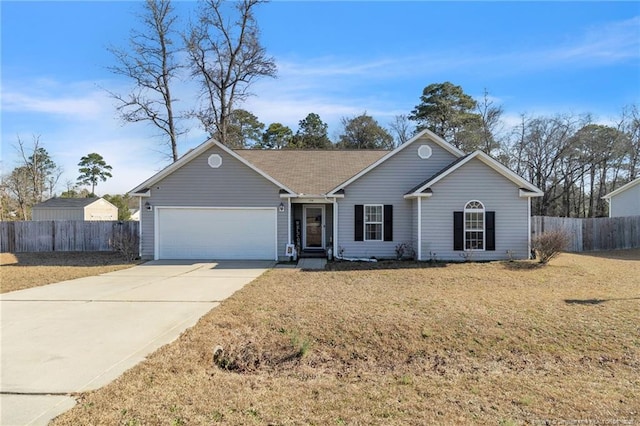 single story home featuring driveway, a front yard, a garage, and fence