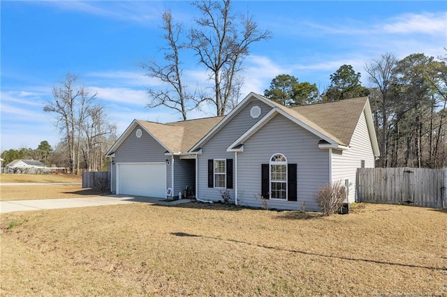 ranch-style house featuring a front lawn, an attached garage, fence, and driveway