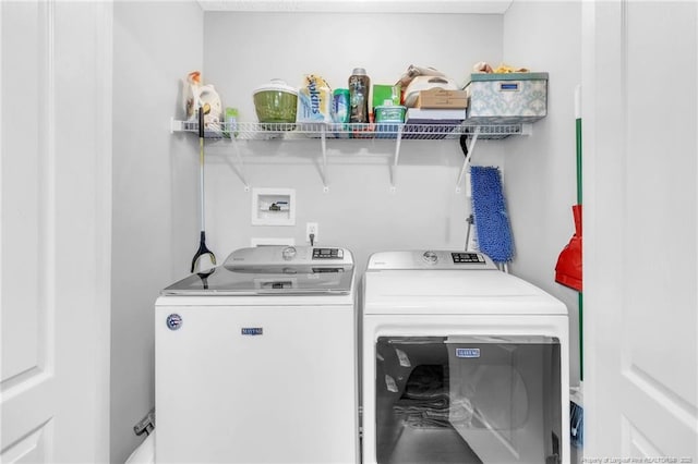 laundry area with laundry area and washing machine and clothes dryer