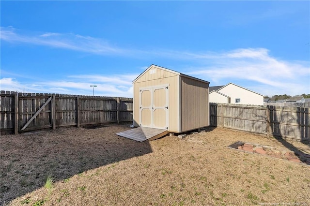 view of shed featuring a fenced backyard