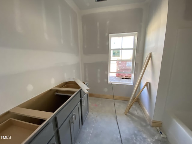 kitchen with baseboards and gray cabinets