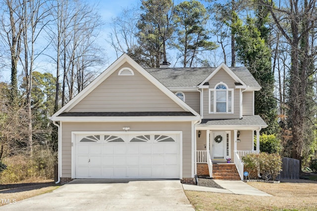 traditional-style home with an attached garage, driveway, and a shingled roof