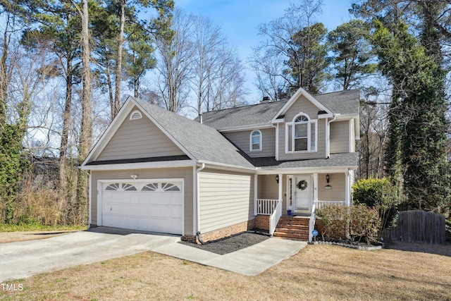 traditional home with a garage, covered porch, concrete driveway, roof with shingles, and a front yard