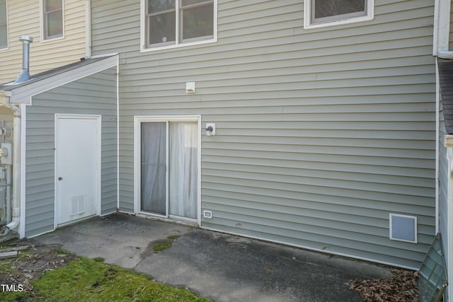 property entrance with visible vents