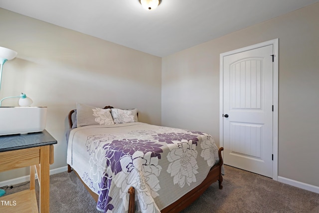 carpeted bedroom with baseboards