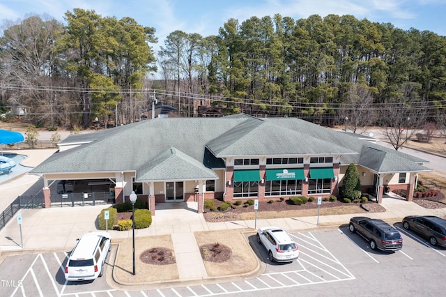 view of building exterior featuring uncovered parking