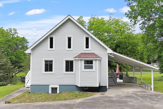 524 N Occoneechee St, Hillsborough, NC 27278 - view of side of home with concrete driveway, stairway, an attached carport, and a yard