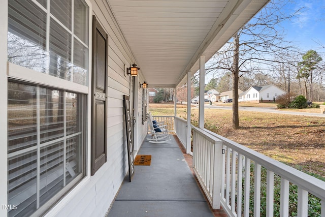 view of patio / terrace featuring a residential view and covered porch