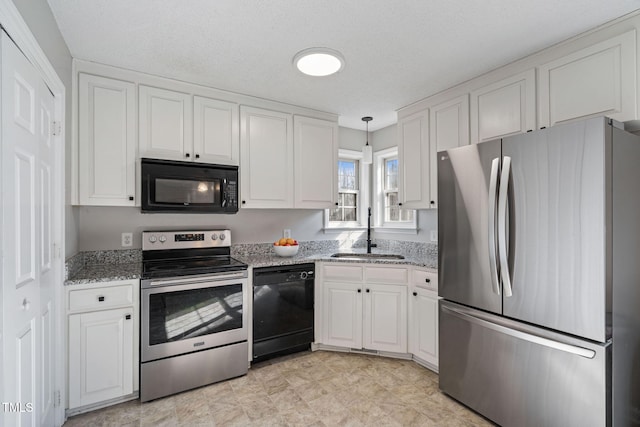 kitchen featuring white cabinets, a sink, and black appliances