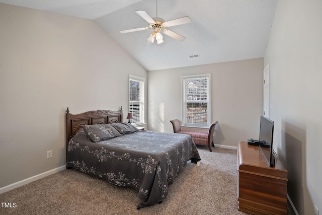 carpeted bedroom with lofted ceiling, visible vents, ceiling fan, and baseboards