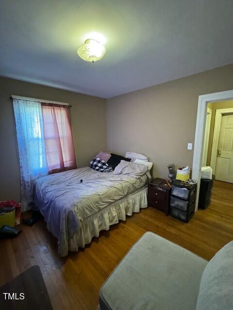 bedroom with wood finished floors