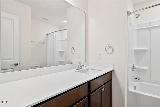 bathroom with visible vents, toilet, shower / bathtub combination with curtain, and vanity