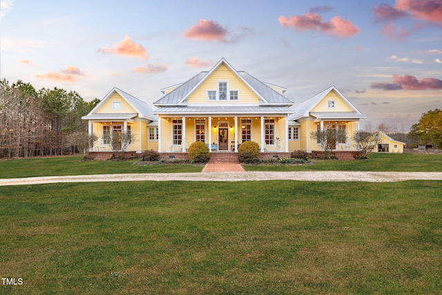 view of front of house with covered porch, crawl space, and a lawn