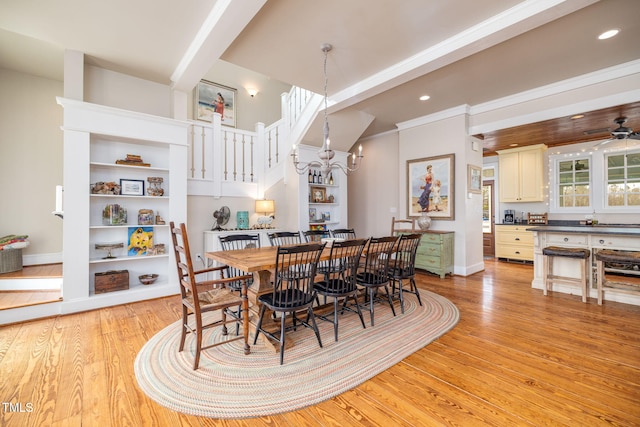 dining space featuring recessed lighting, light wood-style flooring, baseboards, and ceiling fan with notable chandelier