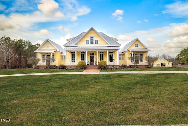 view of front of house with metal roof, a porch, crawl space, a standing seam roof, and a front yard