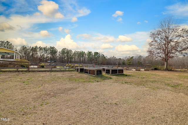 view of yard with a rural view