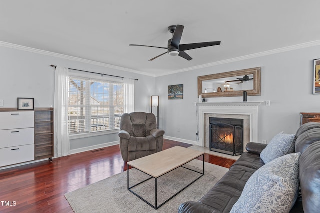 living room featuring ornamental molding, visible vents, and wood finished floors