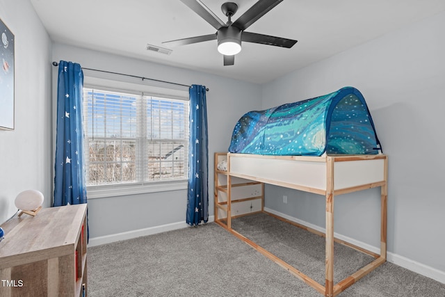 bedroom with carpet floors, visible vents, baseboards, and a ceiling fan