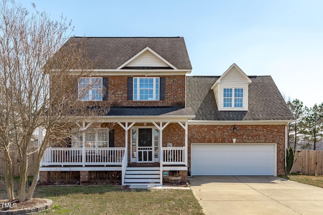 view of front of property with a garage, covered porch, concrete driveway, and brick siding