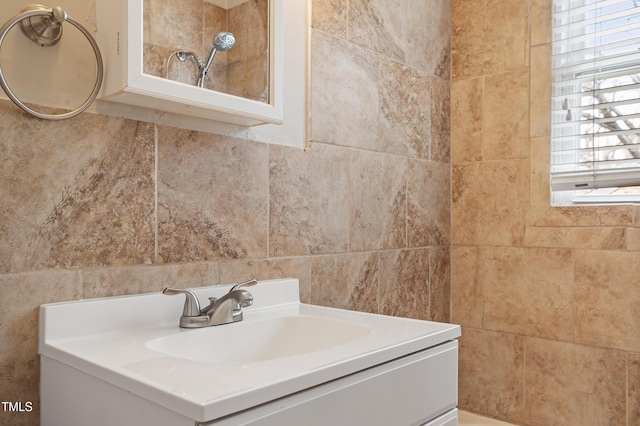 bathroom with tile walls and vanity