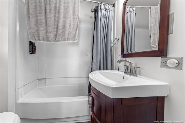 full bath featuring shower / tub combo, vanity, and toilet