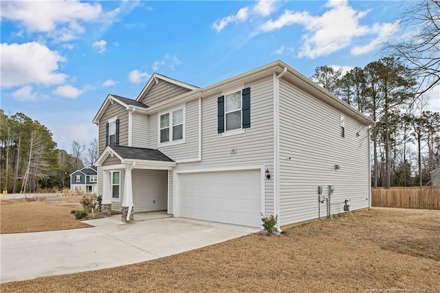 view of front of property with a garage and concrete driveway