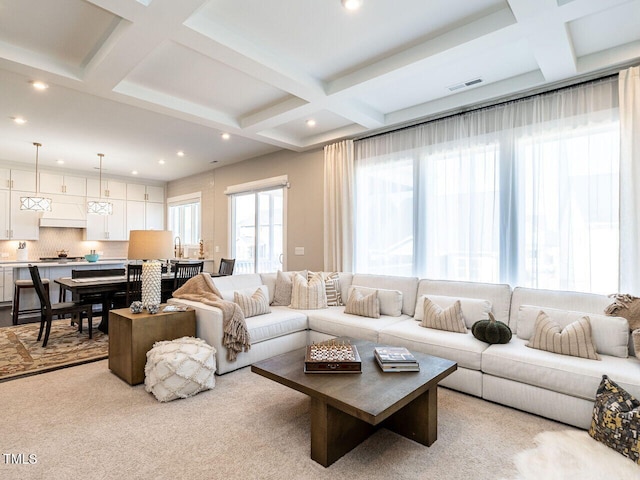 living room with beam ceiling, visible vents, recessed lighting, and coffered ceiling