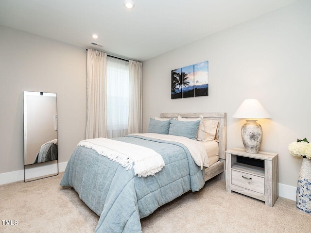 bedroom with light carpet, recessed lighting, visible vents, and baseboards